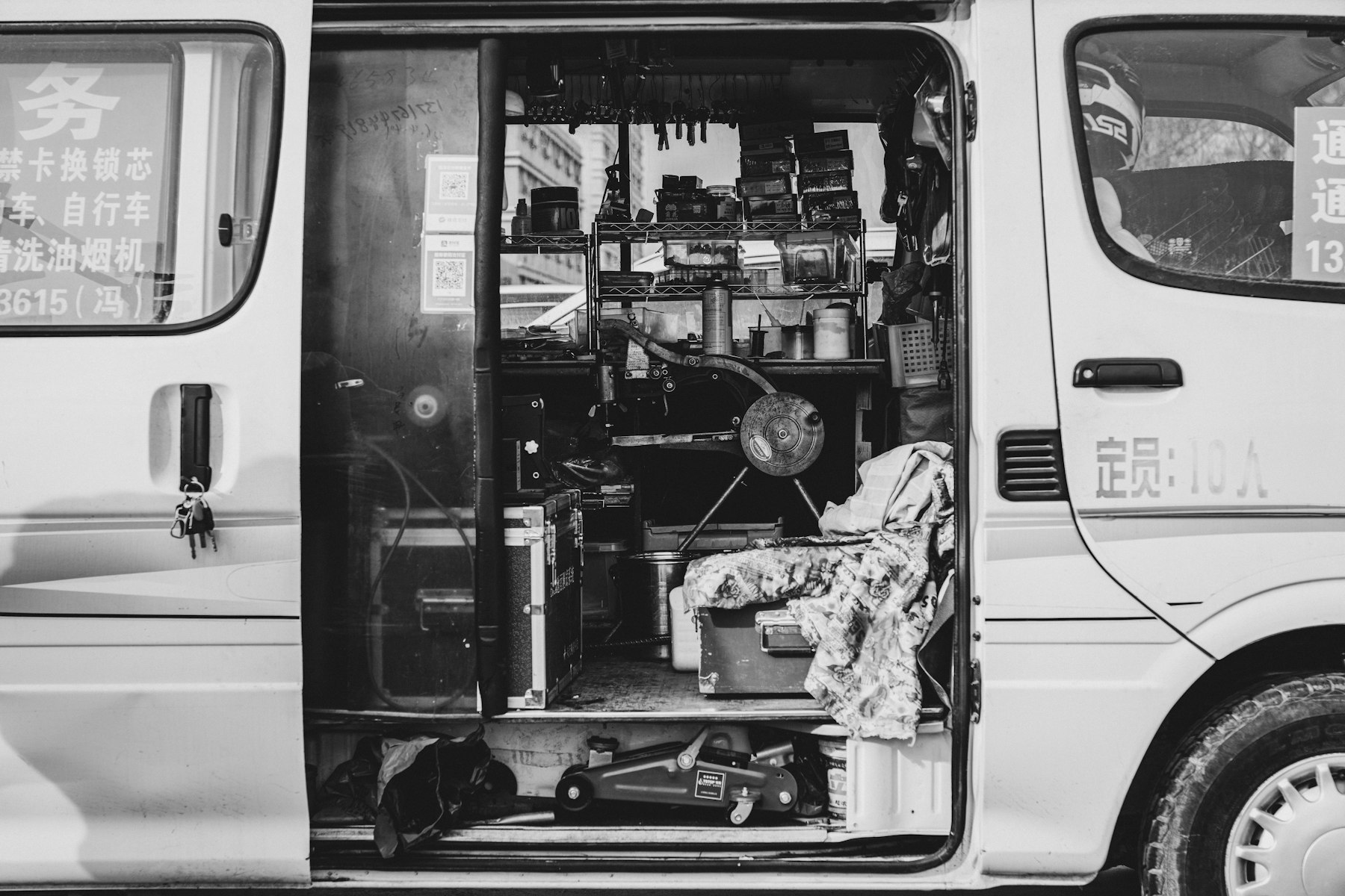 Open mobile workshop van with tools and equipment
